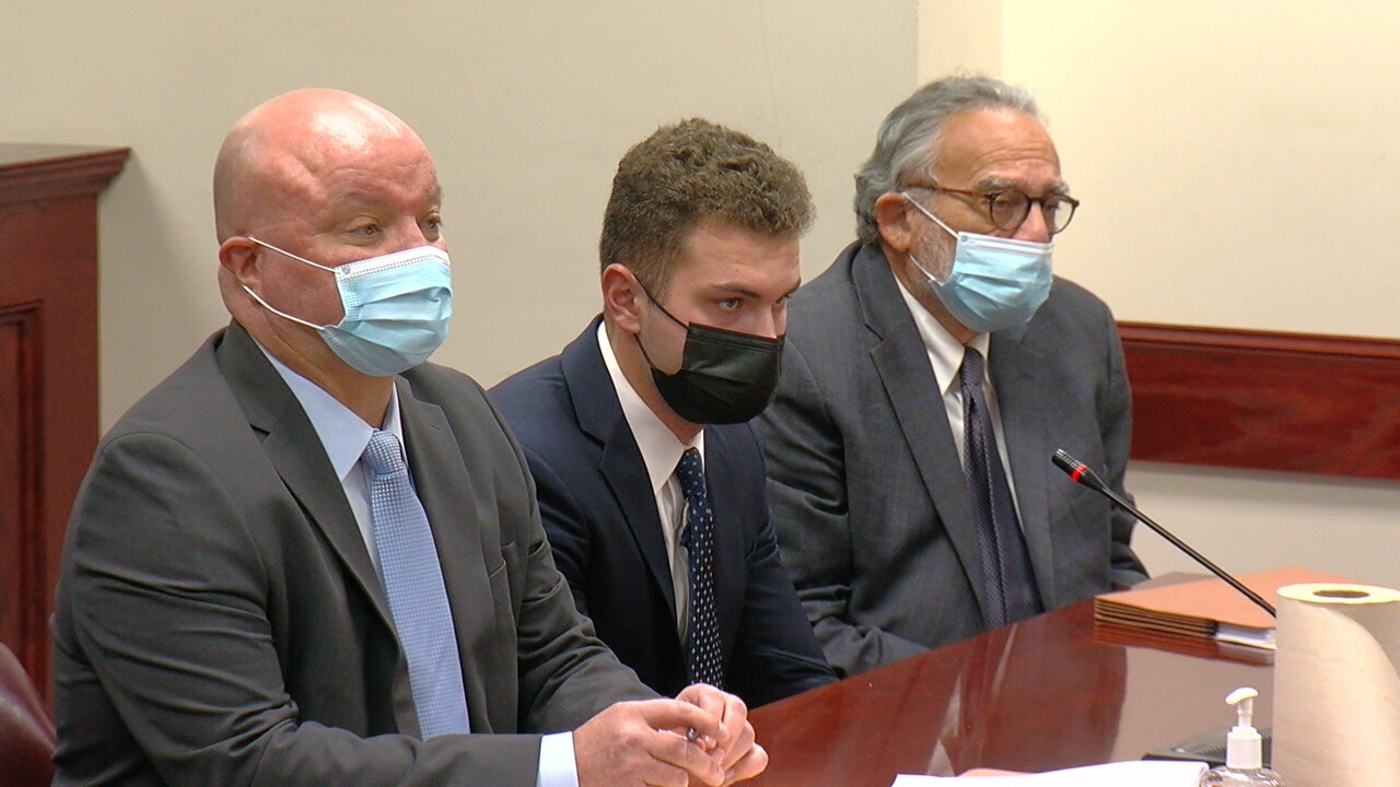 Christopher Belter and his legal team sitting in court